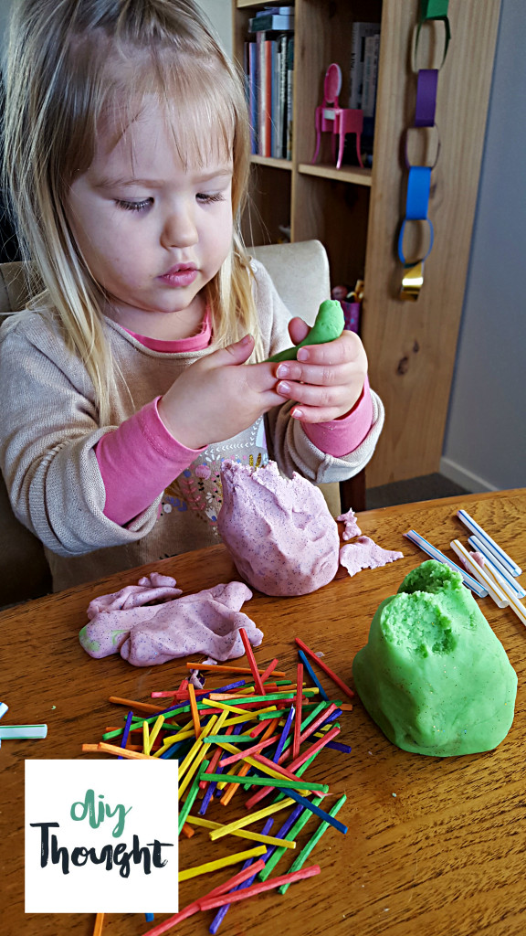 child playing with playdough 