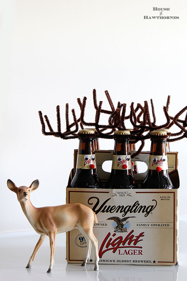A six pack of bottles dressed up as reindeer