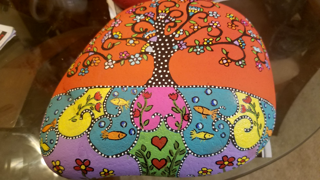 tree and fish painted rock