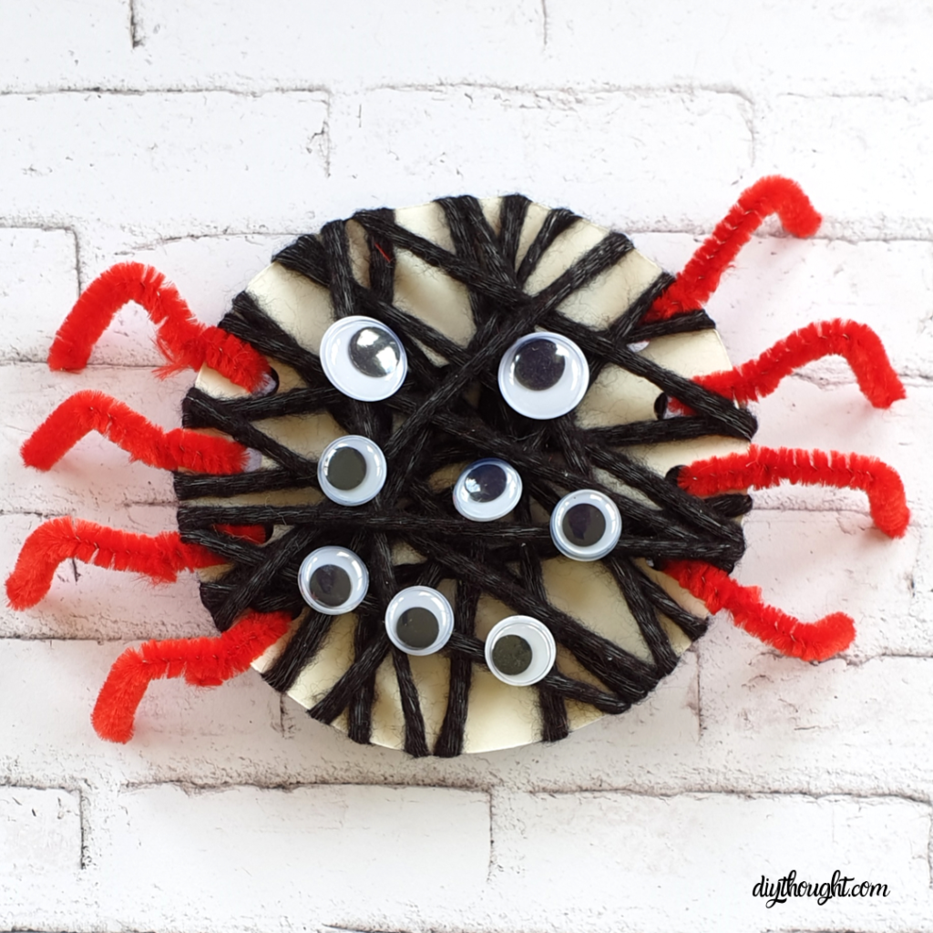 Threading and yarn wrapped spider craft
